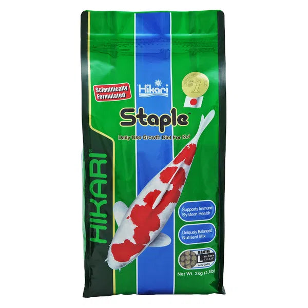 Hikari Staple fish food packaging on a white background at Pet Servo