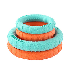 Stack of turquoise and orange textured rings on a white background at Pet Servo