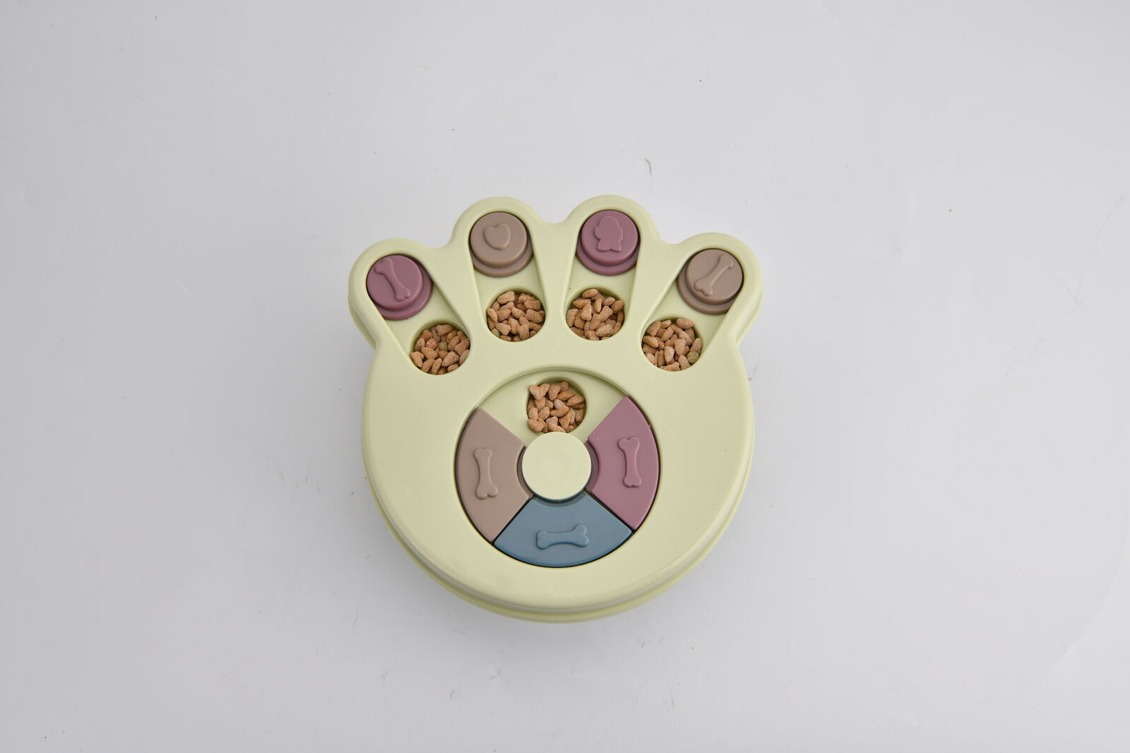 Paw-shaped pet toy with colorful interior on a light gray background at Pet Servo