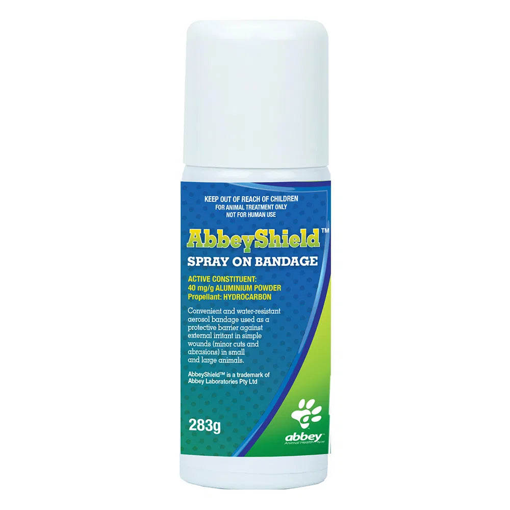 AbbeyShield spray on bandage container with blue and green label on a white background