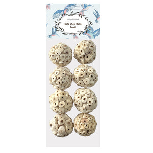 A package of eight small ivory bone chew balls arranged in two columns on a white card with a blue and black bird illustration header. The text on the header reads 'Mille Island' and 'Solo Chew Balls Small' at Pet Servo