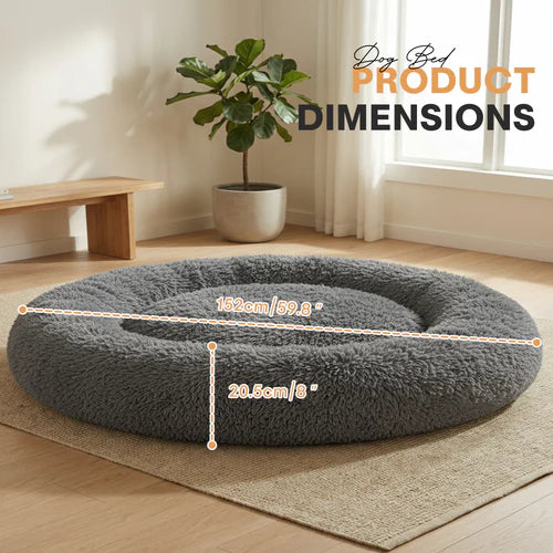 Gray dog bed with dimensions labeled in a room with a plant and wooden bench at Pet Servo