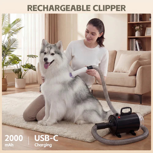 Woman using a rechargeable pet grooming clipper on a dog in a living room at Pet Servo