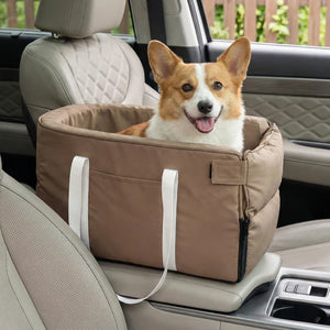 Dog in a brown car seat carrier inside a vehicle at Pet Servo