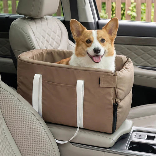 Dog in a brown car seat carrier inside a vehicle at Pet Servo